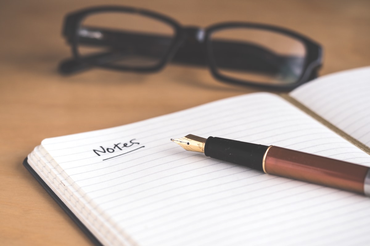 A notebook with a pen