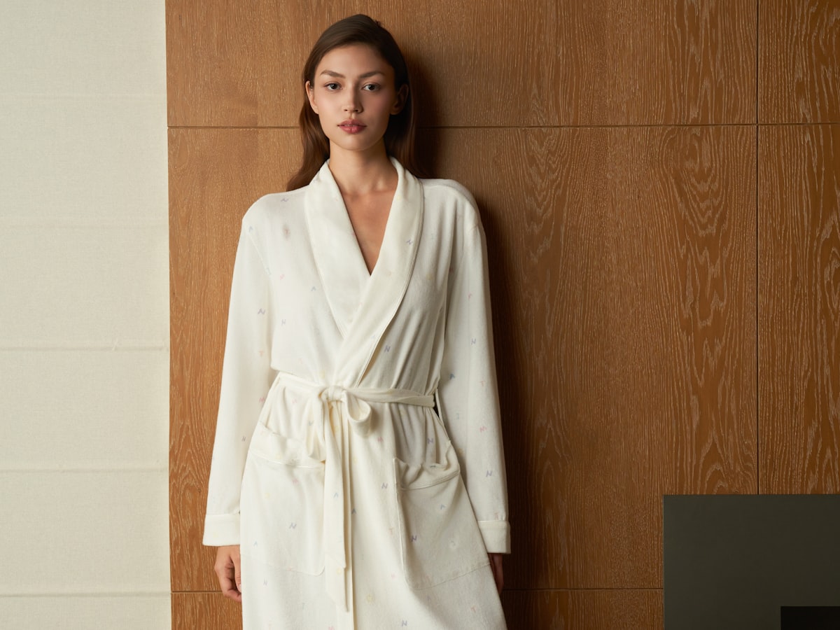 A woman in a soft robe at home
